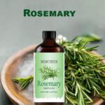 Magic Touch Rosemary Oil, placed beside fresh rosemary leaves. For Hair, Face and body massage. No Side effect for men and women